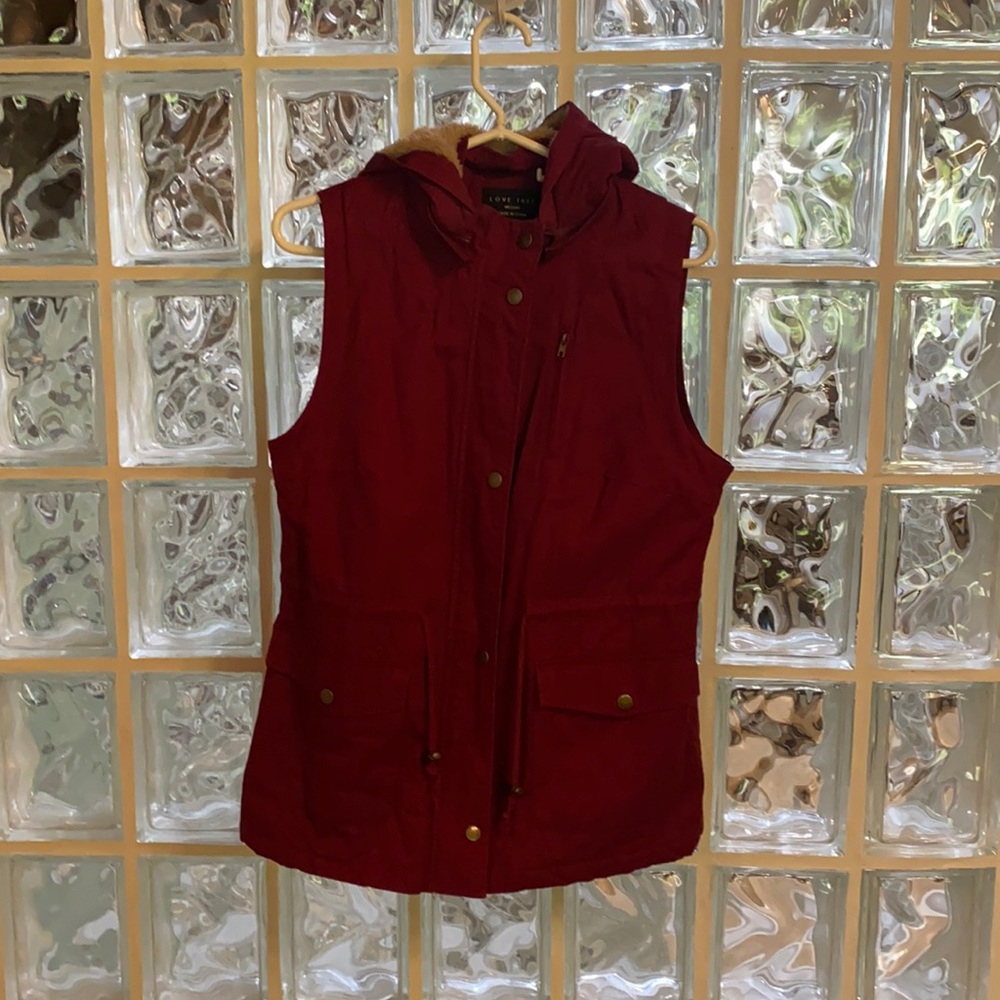 Faux fur with zip off hood vest.